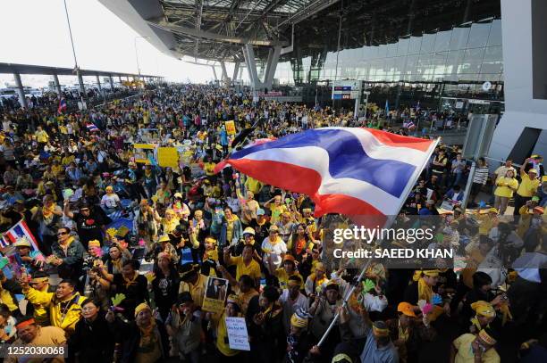 Anti-government protestors celebrate a court's decision against the ruling party during a demonstration at the Suvarnabhumi international airport in...