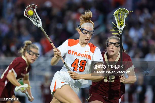 Maddy Baxter of Syracuse Orange moves the ball against Cassidy Weeks of Boston College Eagles during the second quarter on April 20, 2023 in...