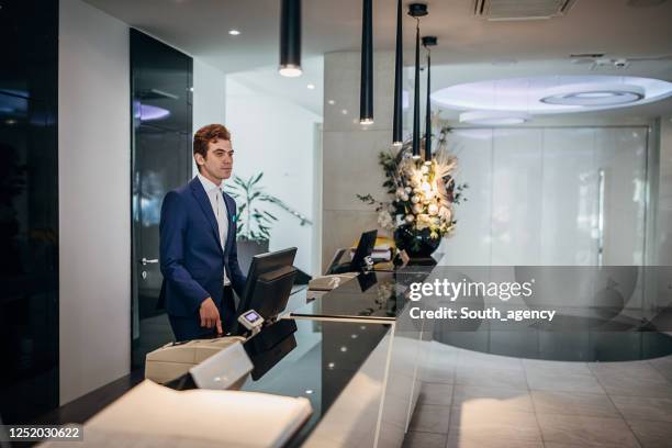 Hotel Receptionist Job Using Computer Hotel Receptionist On Computer Photos and Premium High Res Pictures ...