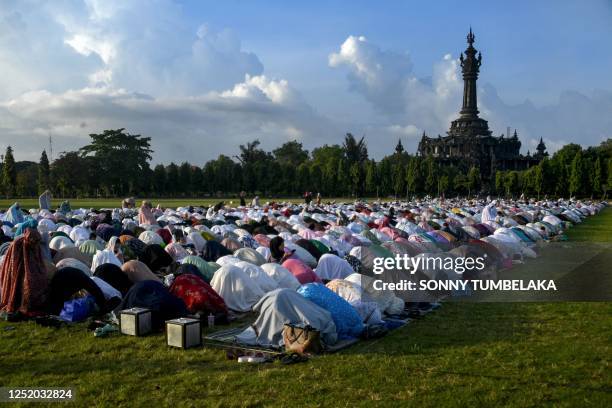 Muslims take part in a morning prayer celebrating Eid al-Fitr, which marks the end of the holy month of Ramadan, near the Bajra Sandhi Monument in...