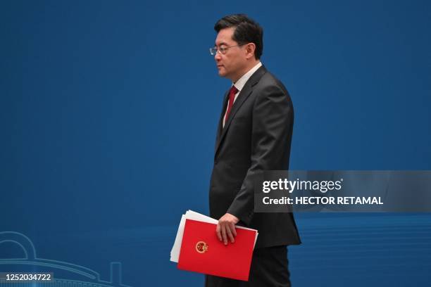 Qin Gang, State Councilor and Foreign Minister of China, walks off stage after delivering a speech during the opening ceremony of the Lanting Forum,...