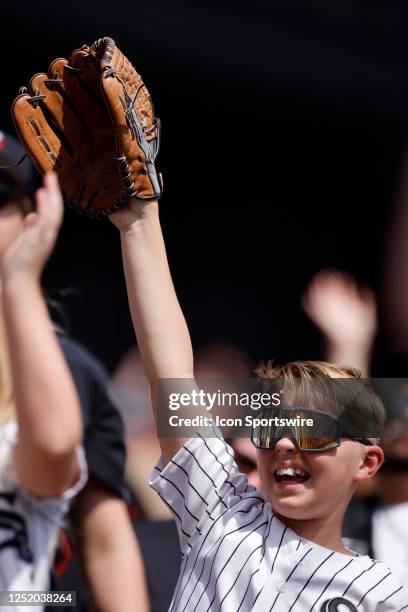 Chicago White Sox fan pleads for a baseball during an MLB game against the Baltimore Orioles on April 15, 2023 at Guaranteed Rate Field in Chicago,...