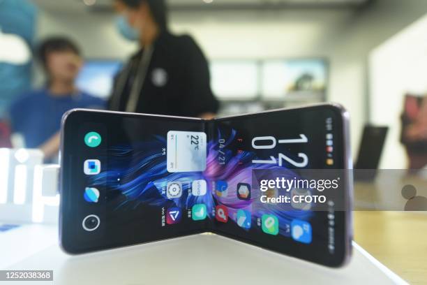 Photo taken on April 21, 2023 shows X Flip2 foldable mobile phone at a vivo store in Hangzhou, east China's Zhejiang Province.