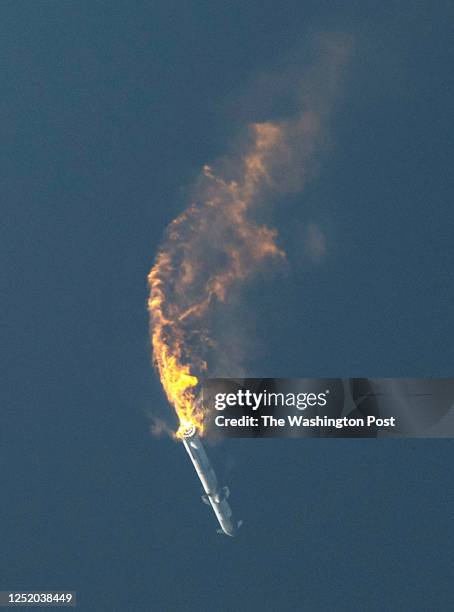 SpaceX's Starship spacecraft and Super Heavy rocket turns upside down and explodes during launch from Starbase on April 20, 2023.