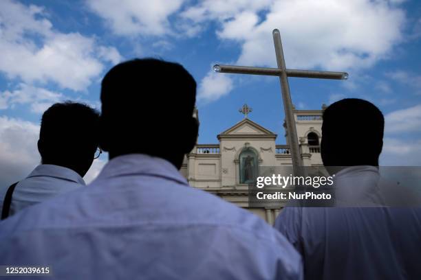 People gather in front of St. Anthony's Shrine in Kochchikade for justice for the 2019 Easter bombing victims on April 21 in Colombo,Sri Lanka. A...
