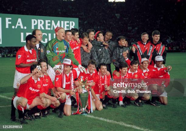 Manchester United players celebrate with the new Premier League trophy after the FA Premier League match between Manchester United and Blackburn...