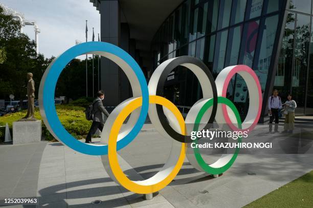 The Olympic Rings is displayed near the National Stadium where the Tokyo 2020 Olympic Games were held in Tokyo on April 21, 2023. - The former...