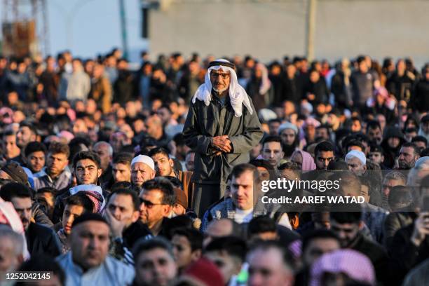 Muslim worshippers pray on the first day of Eid al-Fitr, which marks the end of the holy fasting month of Ramadan, in Syria's rebel-held town of Bab...