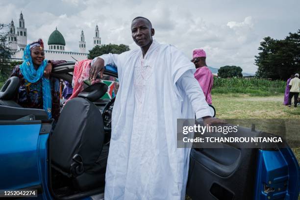 Muslim worshippers pose after the prayer on the first day of Eid al-Fitr, which marks the end of the holy fasting month of Ramadan, in Bujumbura on...