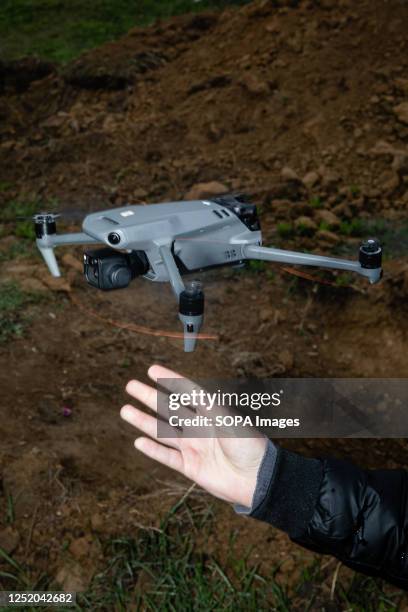 Drone operator launches a quadcopter to observe kamikaze drones in flight. Ukrainian soldiers conducted a kamikaze drone training exercise. The...