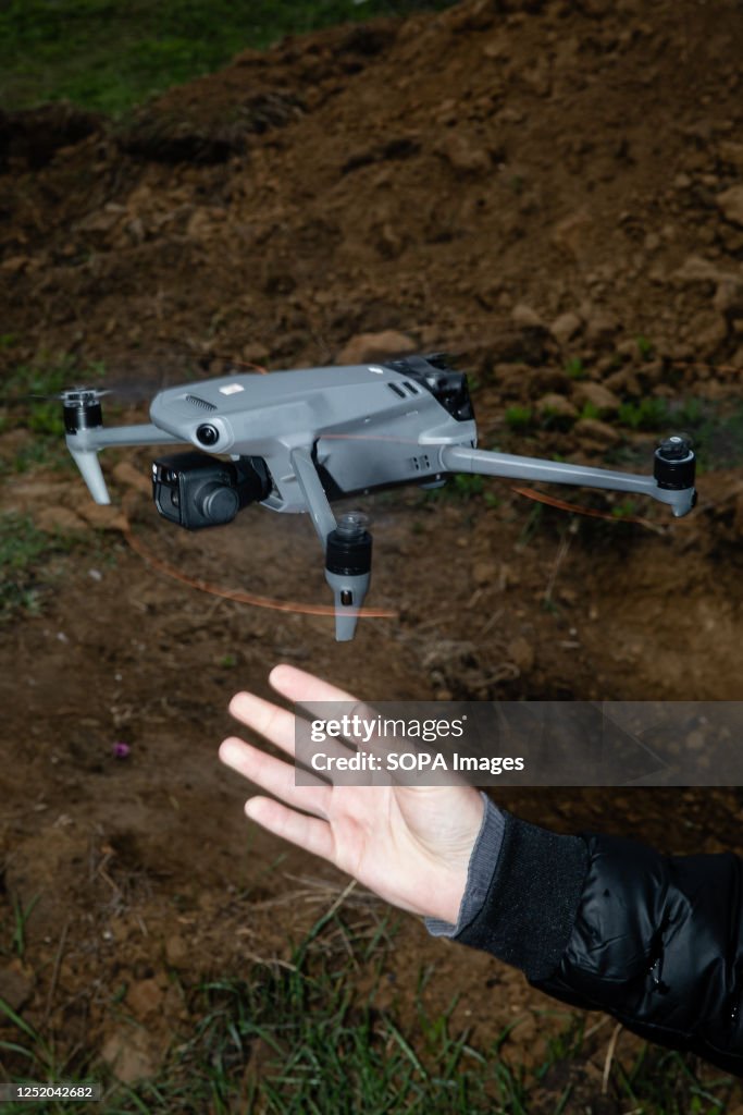 A drone operator launches a quadcopter to observe kamikaze...