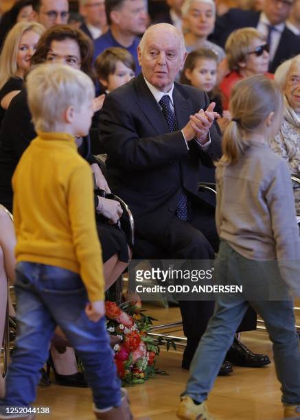 Argentine-born pianist and conductor Daniel Barenboim and his wife Russian-born pianist Elena Bashkirova applaud to a children's choir after...