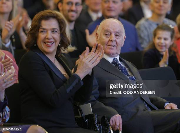 Argentine-born pianist and conductor Daniel Barenboim and his wife Russian-born pianist Elena Bashkirova applaud to a children's choir after...