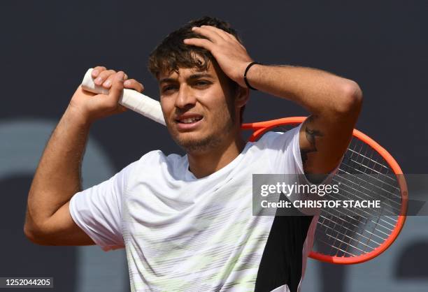 Italy's Flavio Cobolli reacts during his quarter final match against Australia's Christopher O'Connell at the ATP tennis BMW Open in Munich, southern...