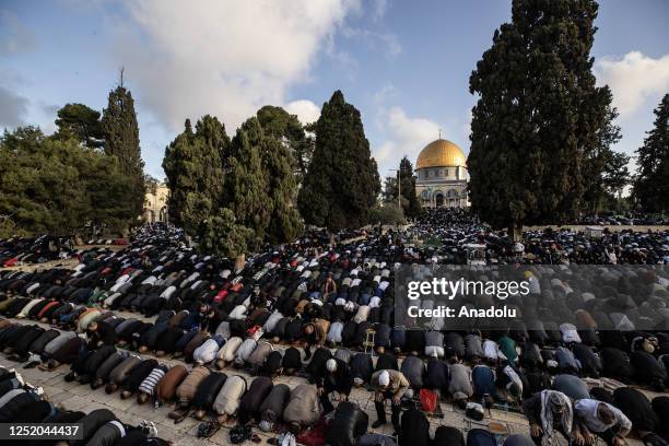 Muslims perform the Eid al-Fitr prayer in front of the Qubbat al-Sakhra at Masjid al-Aqsa Compound in East Jerusalem on April 21, 2023. Eid al-Fitr...