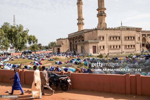 Worshippers pray during the Eid al-Fitr prayers at the King Fahad Mosque in Banjul on April 21, 2023.