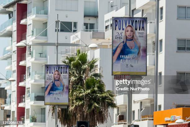 An poster about an upcoming event with a Russian performer is seen in Germasogia area where most Russian speaker people in Limassol live, on Apr. 21,...