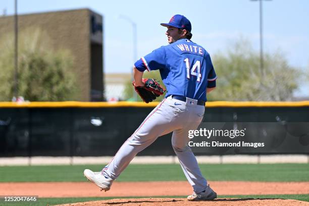 Owen White of the Texas Rangers throws a pitch during a minor league spring training game against the Kansas City Royals at Surprise Stadium on March...