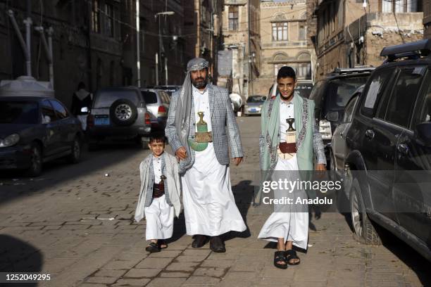 Yemeni people in traditional dress go to perform the Eid al-Fitr prayer at a mosque in Sanaa, Yemen on April 21, 2023