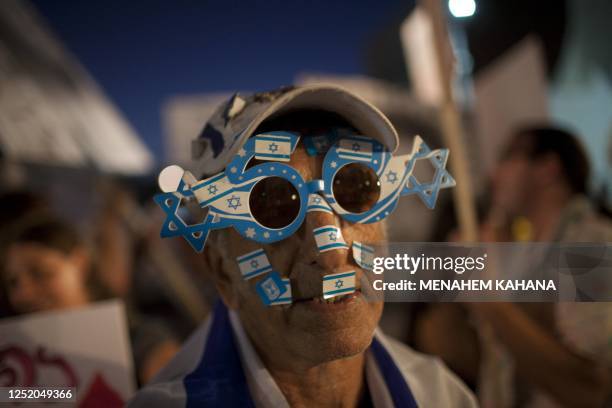 One of an estimated 400,000 Israelis demonstrates in the center of Tel Aviv on September 3, 2011 to protest against rising housing prices and social...