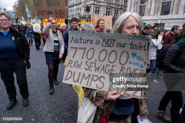 Thousands of protesters from various environmental groups including those against sewage and river pollution join together with Extinction Rebellion...