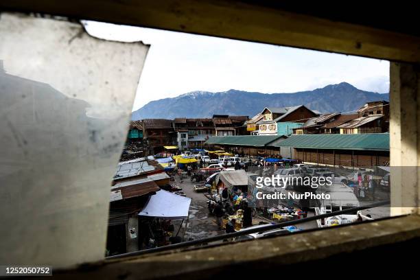 People purchase from a market in Srinagar Jammu and Kashmir India on 21 April 2023
