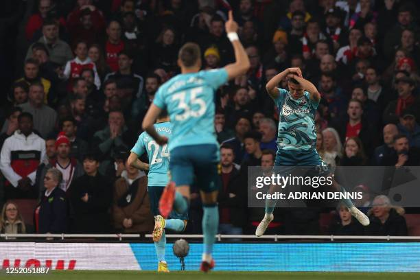 Southampton's Argentinian midfielder Carlos Alcaraz celebrates after scoring the early opening goal during the English Premier League football match...