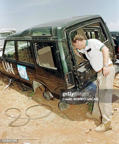 Kevin Marshall, sent by the Land Rover company in London assesses damages in the Land Rover jeeps of the United Nations 08 October 1999 allegedly...