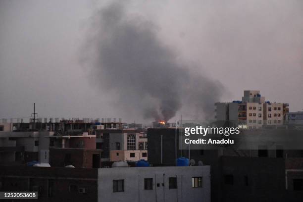 Smoke rises after an intense shelling and gunfights between soldiers and gunmen from the paramilitary Rapid Support Forces in Sudan on April 21, 2023...