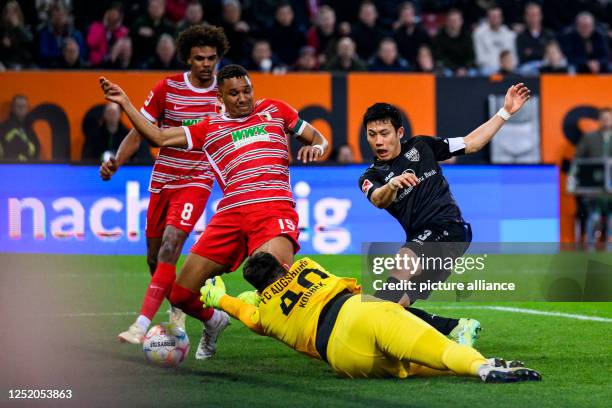 April 2023, Bavaria, Augsburg: Soccer: Bundesliga, FC Augsburg - VfB Stuttgart, Matchday 29, WWK-Arena. Stuttgart's Wataru Endo scores the goal to...