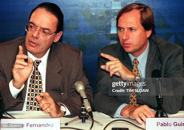 Argentine Minister of Economy Roque Fernandez and Argentine Treasury Secretary Pablo Guidotti answer questions during a press conference 17 April at...