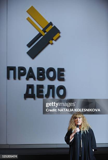 Russian pop singer Alla Pugacheva speaks at a congress of pro-reform Pravoye Delo party in Moscow, on September 15 with the party's logo in the...