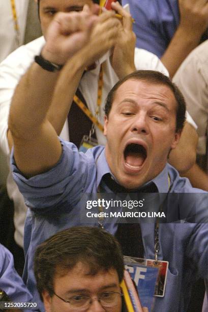 Brazilian stock operators trade over the phones at the Futures market 16 April, 2003 in Sao Paulo, Brazil. The 'real', the Brazilian currency, is...