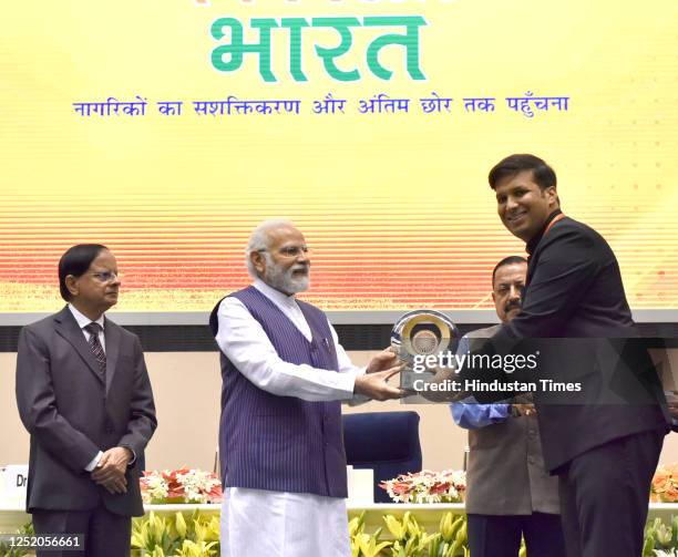 Prime Minister Narendra Modi presenting PMs Award for Excellence in Public Administration 2022 to Ravinder Kumar Mander, Collector Rampur, Uttar...