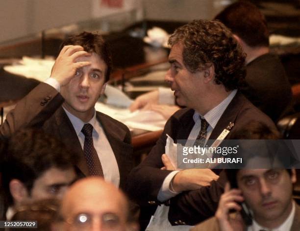 Argentine stock traders watch as stocks plummet 6.24 percent just before closing 29 October in Buenos Aires. The country bond risk marked a new...