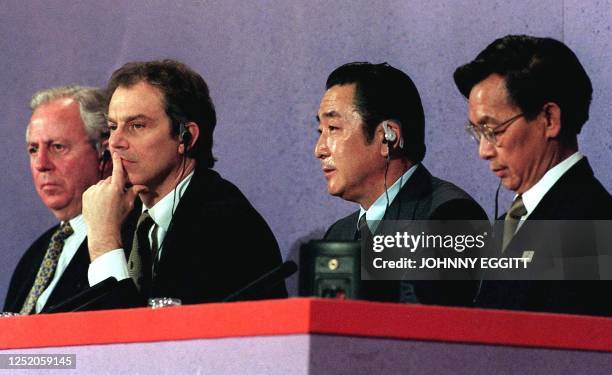 British Prime Minister Tony Blair ponders a question from members of the press during a news conference held at the conclusion of the 2-day ASEM II...
