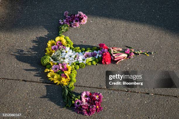 Flowers arranged in the shape of a uterus outside the US Supreme Court in Washington, DC, US, on Friday, April 21, 2023. The Supreme Court blocked a...