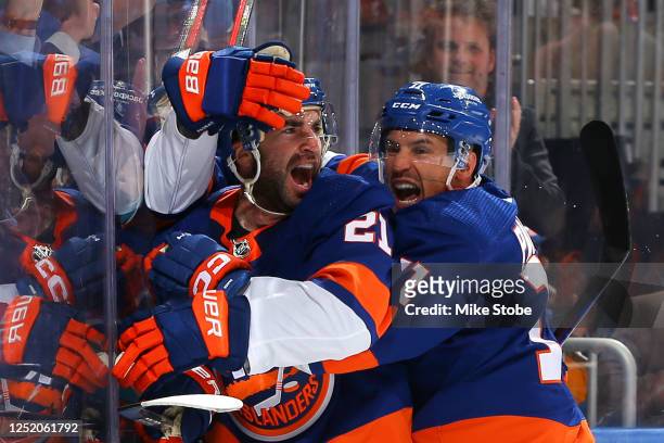 Kyle Palmieri of the New York Islanders is congratulated by Zach Parise after scoring a goal against the Carolina Hurricanes during the third...