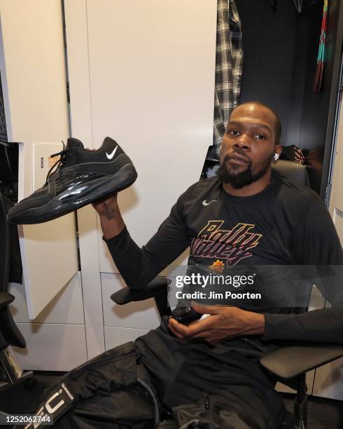 Kevin Durant of the Phoenix Suns holds his sneakers before the game against the LA Clippers during Round 1 Game 1 of the 2023 NBA Playoffs on April...