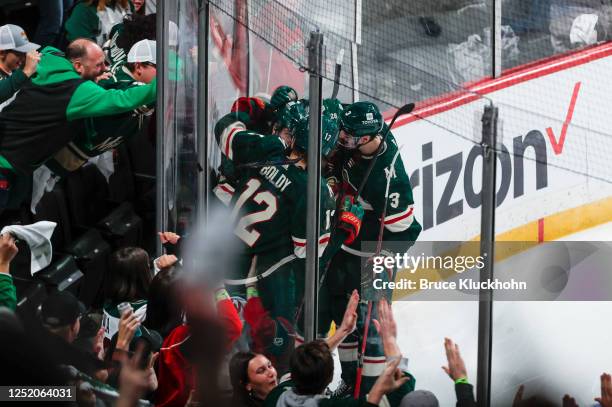 Marcus Johansson of the Minnesota Wild celebrates with teammates after scoring a goal in the second period of Game Three of the First Round of the...