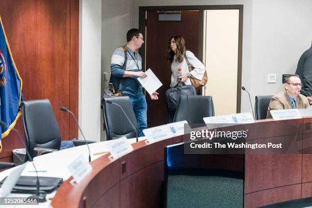 Ottawa County Commissioners Joe Moss, left, and Sylvia Rhodea, right, enter the board room before a Board of Commissioners meeting at Ottawa County's...