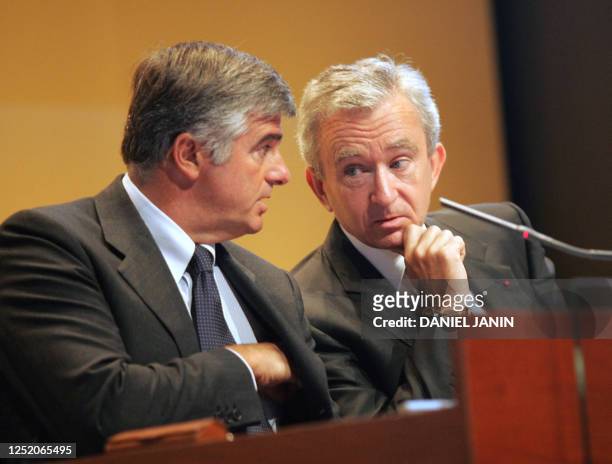 The chairman of the French LVMH luxury goods group, Bernard Arnault , speaks with deputy chief executive officer Antonio Belloni 15 September 2004...