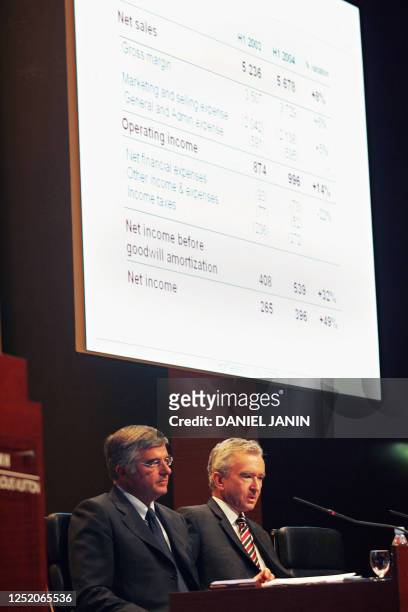 French LVMH luxury group Chairman Bernard Arnault and deputy CEO Antonio Belloni speak, 15 September 2004 in Paris, to present the company's results...