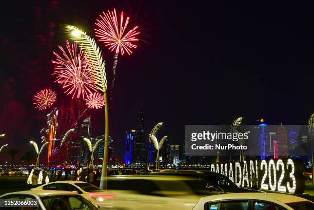 Fireworks light up the sky over Doha Corniche, during celebration of the first day of the Eid al-Fitr festival in Doha, Qatar, on 21 April 2023