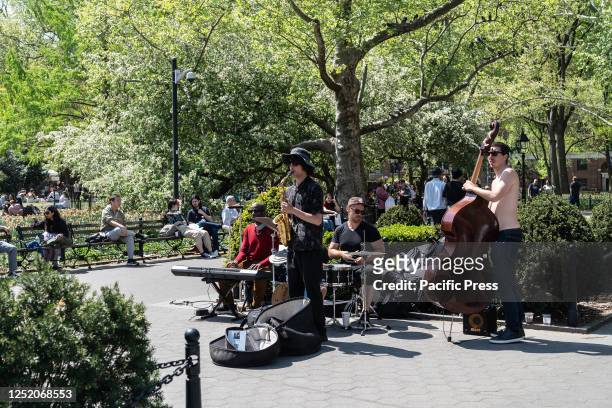 Band plays on a warm spring sunny day in Washington Park.
