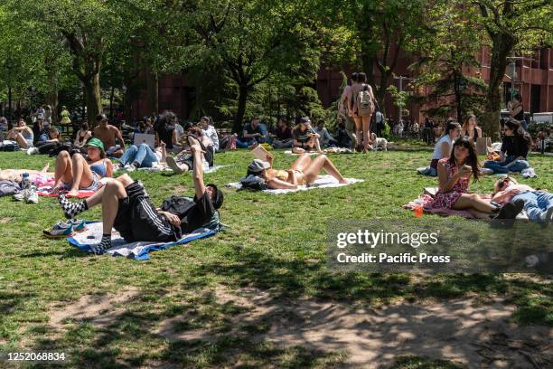 New Yorkers enjoy warm spring sunny day in Washington Park.