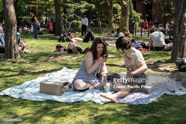 New Yorkers enjoy warm spring sunny day in Washington Park.