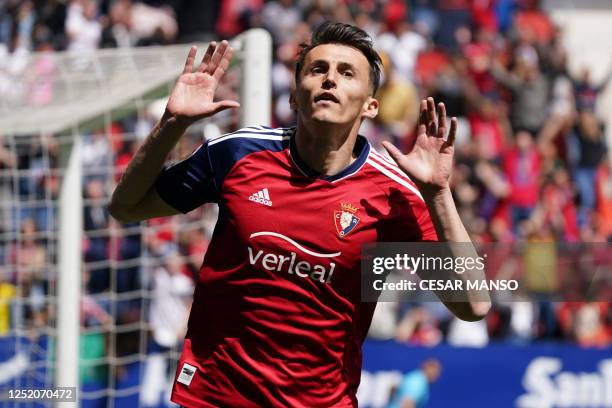 Osasuna's Croatian forward Ante Budimir celebrates scoring the opening goal during the Spanish league football match between CA Osasuna and Real...