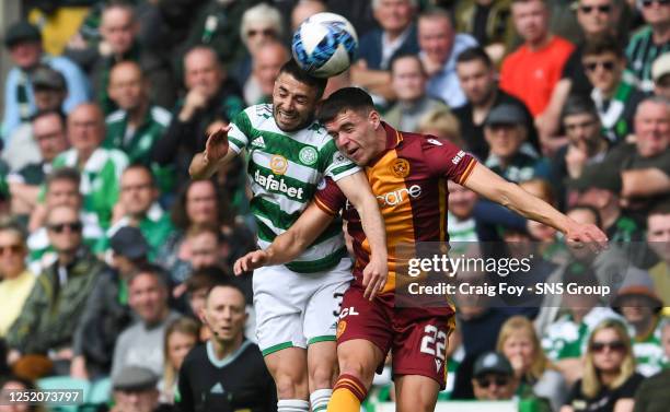 Celtic's Greg Taylor and Motherwell's Max Johnston during a cinch Premiership match between Celtic and Motherwell at Celtic Park, on April 22 in...