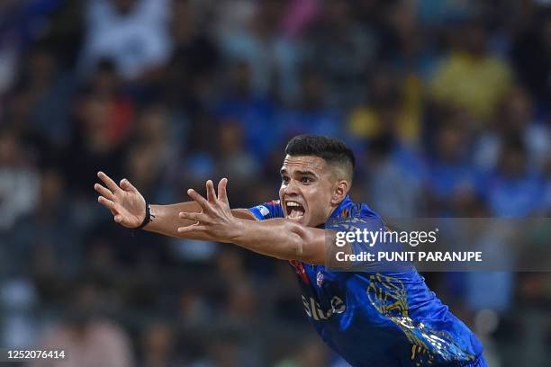 Mumbai Indians' Arjun Tendulkar successfully appeals against Punjab Kings' Prabhsimran Singh during the Indian Premier League Twenty20 cricket match...